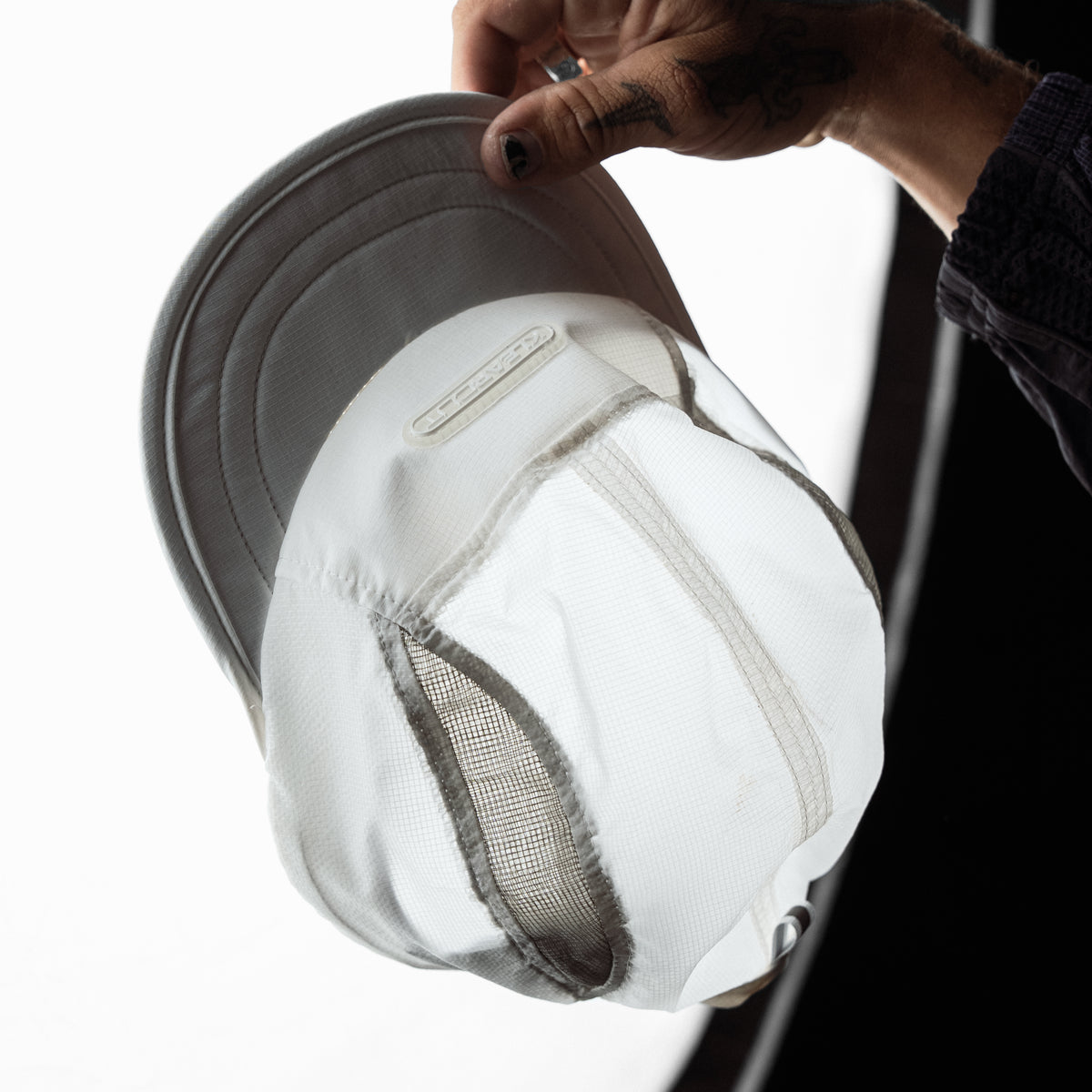 PEAKWORK cap worn on the trail